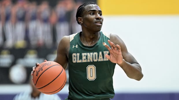 Ja'Corey Lipkins of GlenOak bring the ball up the floor against Jackson in a game on December 22, 2023.